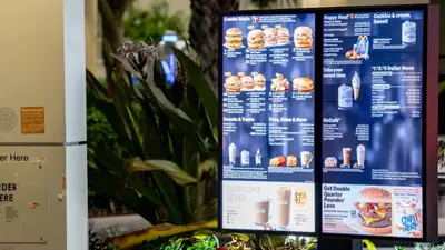 McDonald’s tests ads from other brands on digital drive-thru menu boards